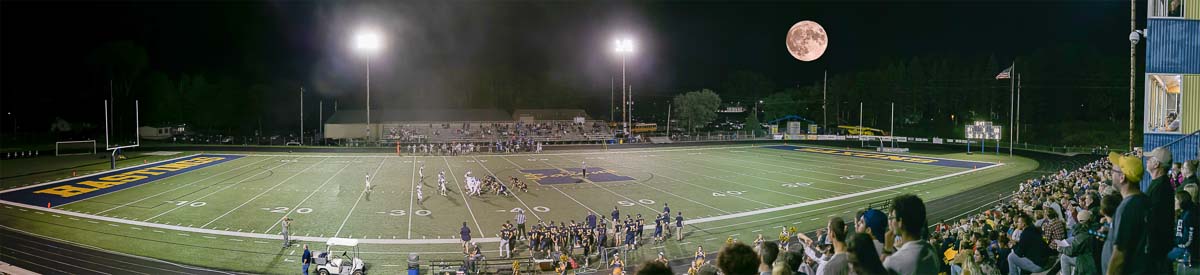 Hastings Band on football field with full moon