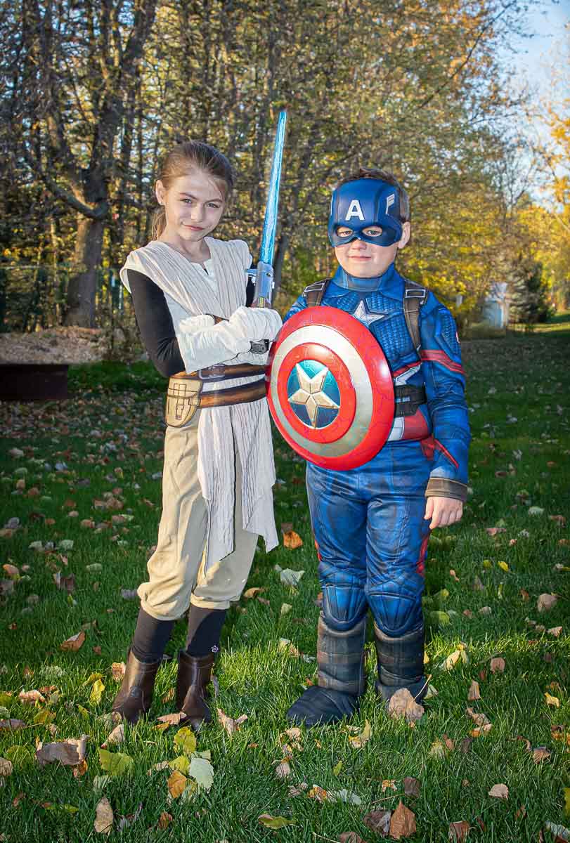 Two children dressed in Halloween costumes