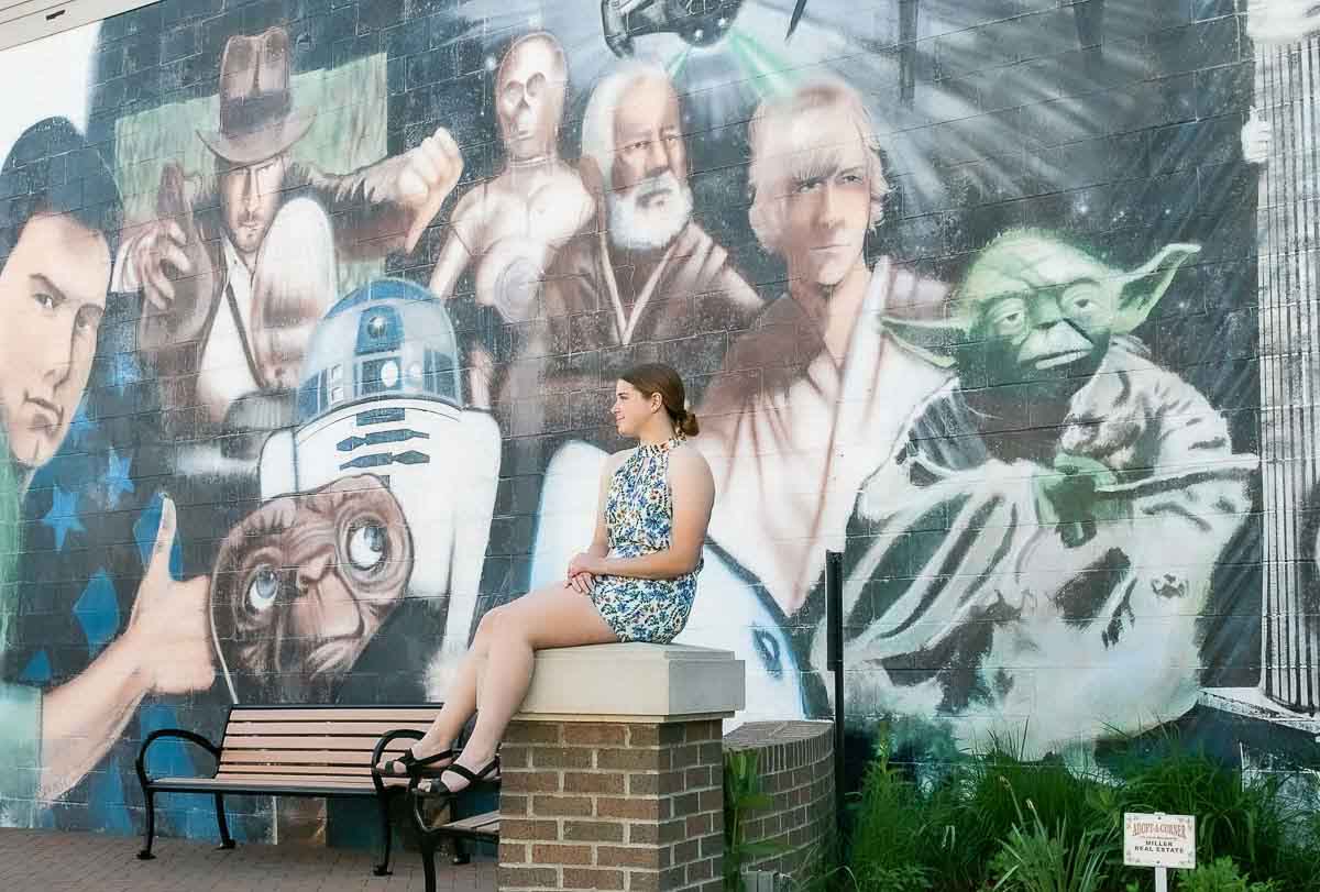 Senior with movie mural background